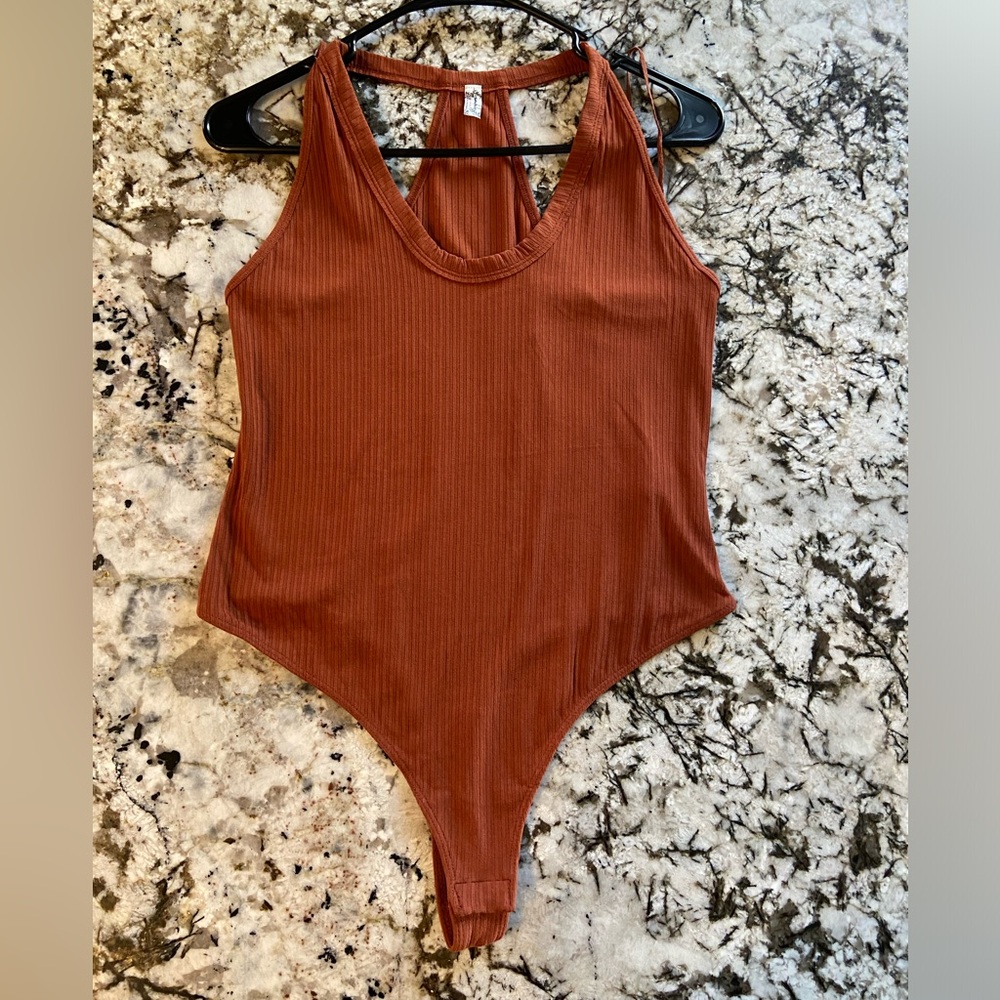 FREE PEOPLE INTIMATELY BURNT ORANGE BODY SUIT